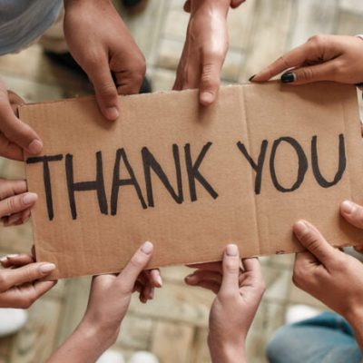 10 hands hold sign saying donor thank you